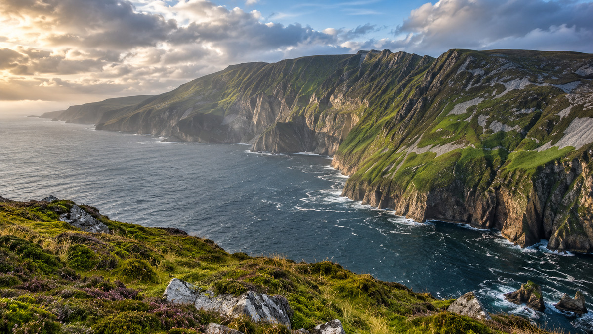 High green sea cliffs rising above the Atlantic at Sliabh Liag in County Donegal